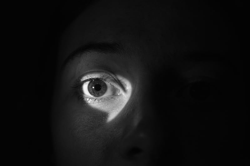 Silhouette of a spy with binoculars